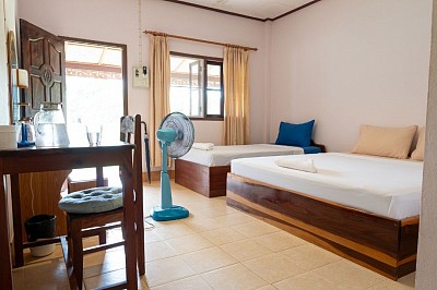 Air-con room on the yard side with access to the riverside and hammock garden